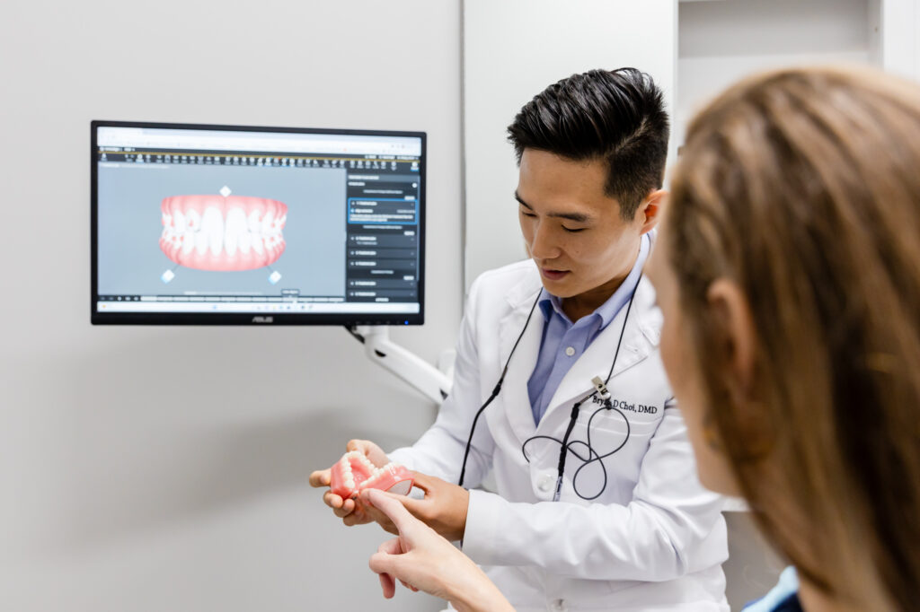 cosmetic dentist talking to a patient about restorative dentistry in Herndon, VA.