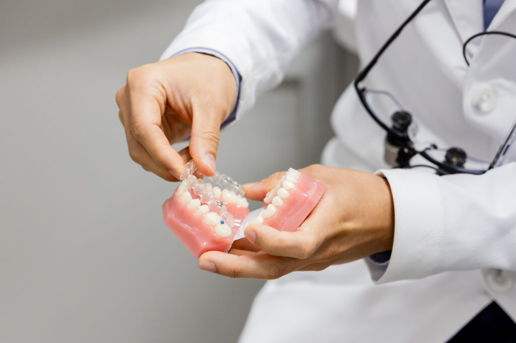 Cosmetic dentist showcasing how Invisalign in Herndon works.