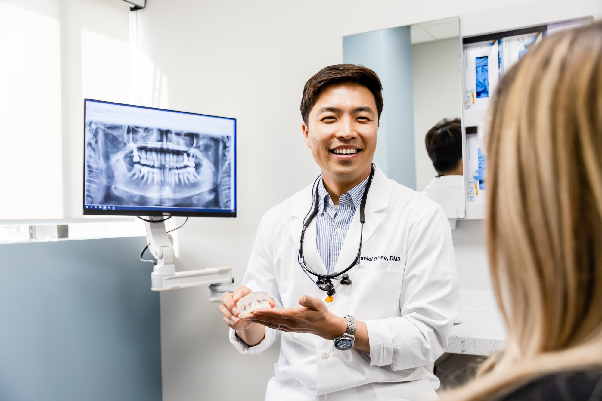 Cosmetic dentist talking about dental implants in Herndon, VA.