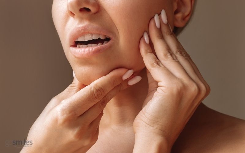 woman with jaw pain who needs tmj treatment in herndon va